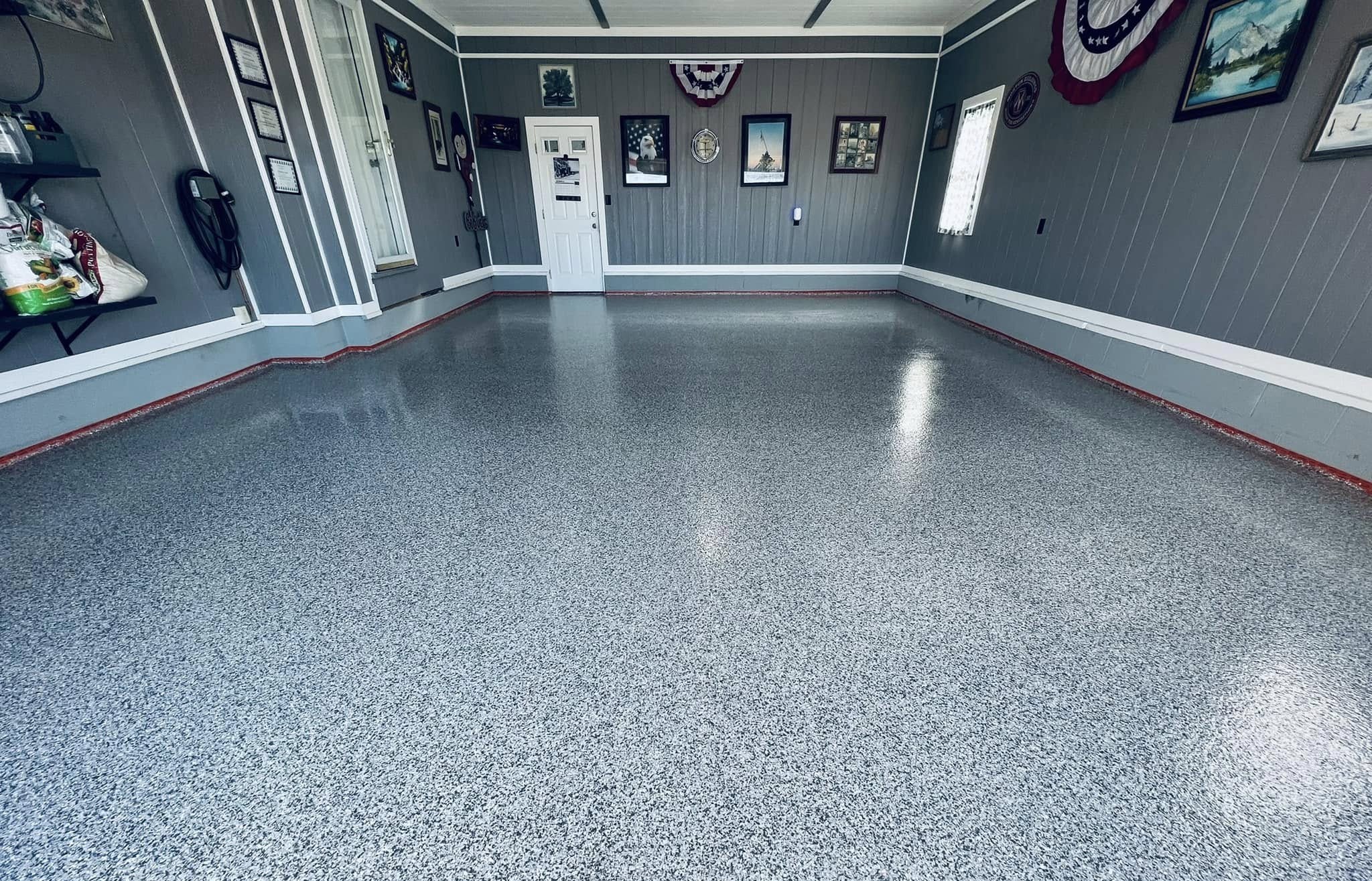 Gray flake-epoxy floor in a finished residential garage